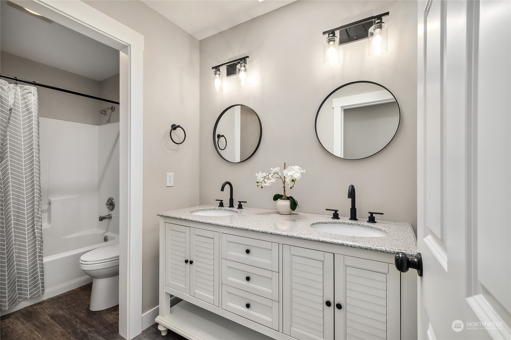 24827 247th Place Southeast Maple Valley, WA 98038 - Photo 22 of 33 a bathroom with a toilet sink and mirror
