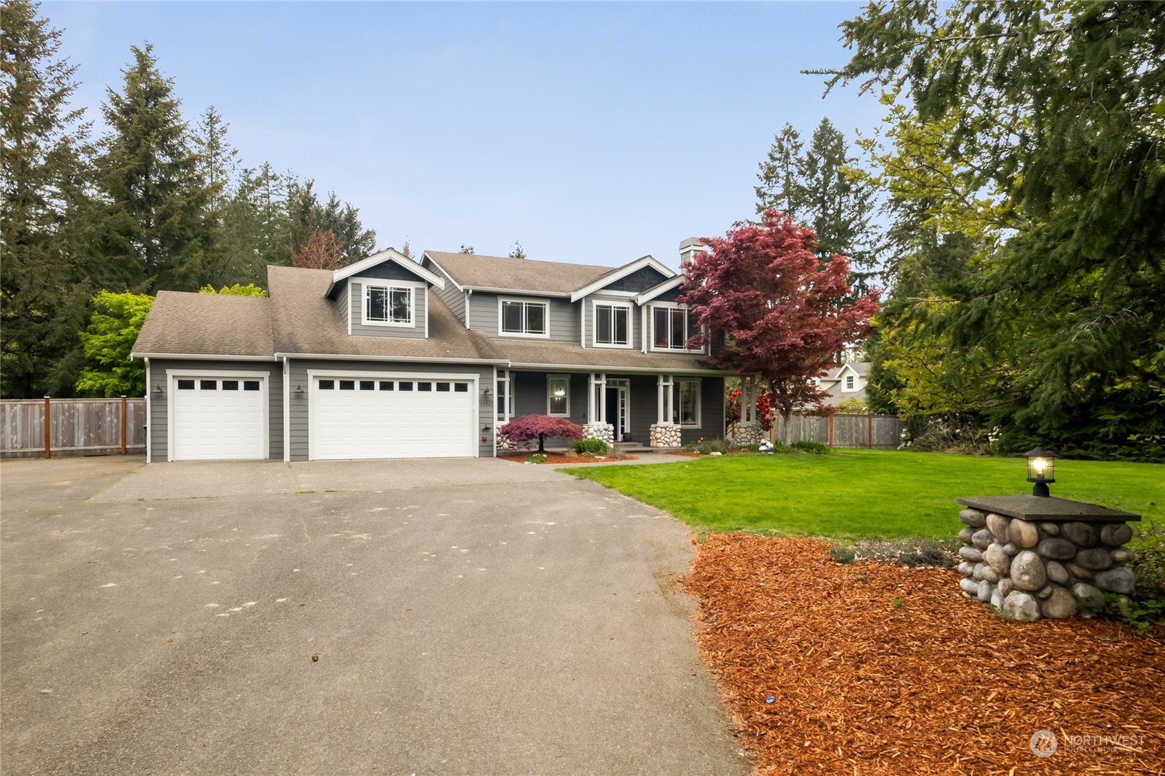 24827 247th Place Southeast Maple Valley, WA 98038 - Photo 24 of 33 a view of a house with a yard and sitting area