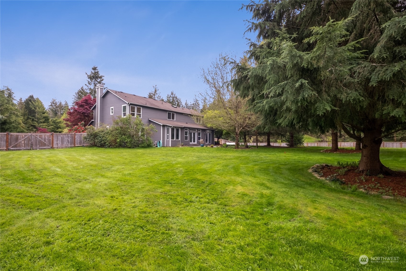 24827 247th Place Southeast Maple Valley, WA 98038 - Photo 27 of 33 a view of a house with a big yard