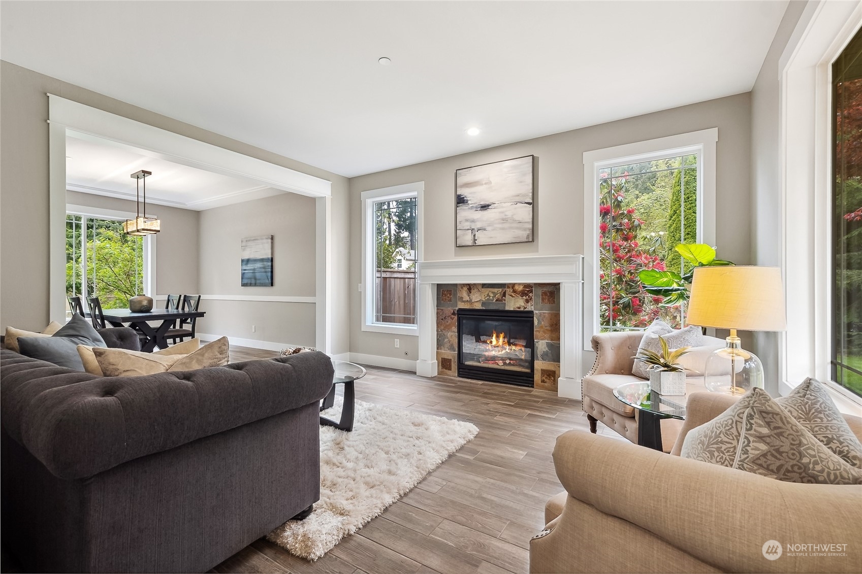 24827 247th Place Southeast Maple Valley, WA 98038 - Photo 5 of 33 a living room with furniture and a fireplace