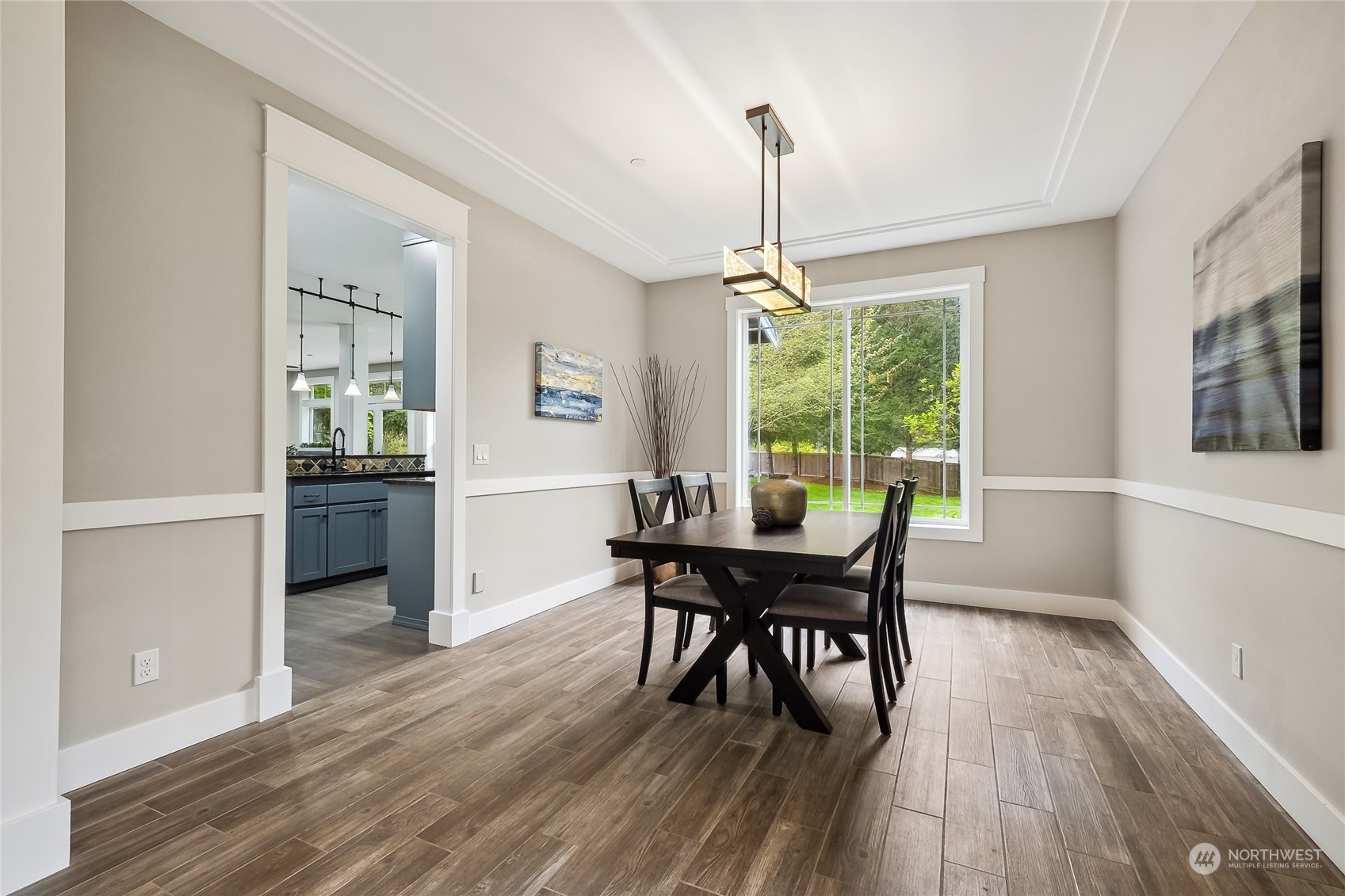 24827 247th Place Southeast Maple Valley, WA 98038 - Photo 6 of 33 a view of a dining room with furniture window and wooden floor