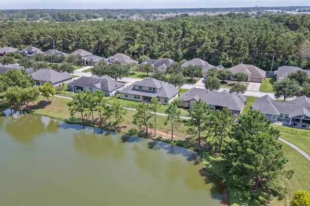 an aerial view of house with yard swimming pool and outdoor seating