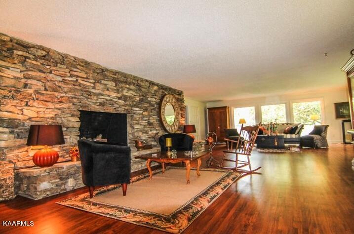 810 Whitaker Road New Market, TN 37820 - Photo 12 of 54 a living room with furniture a flat screen tv and a fireplace