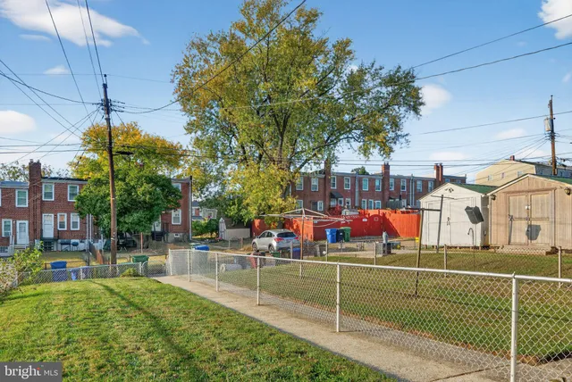 a view of a park with swings and slides