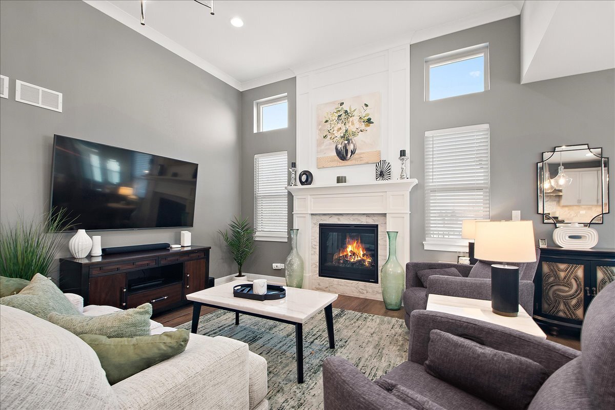 1330 Lacoma Drive Lockport, IL 60441 - Photo 12 of 36 a living room with furniture a flat screen tv and a fireplace