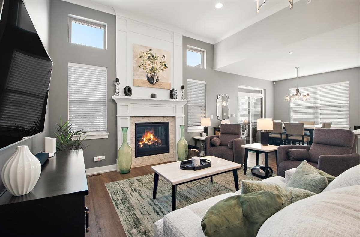 1330 Lacoma Drive Lockport, IL 60441 - Photo 13 of 36 a living room with furniture a rug and a fireplace