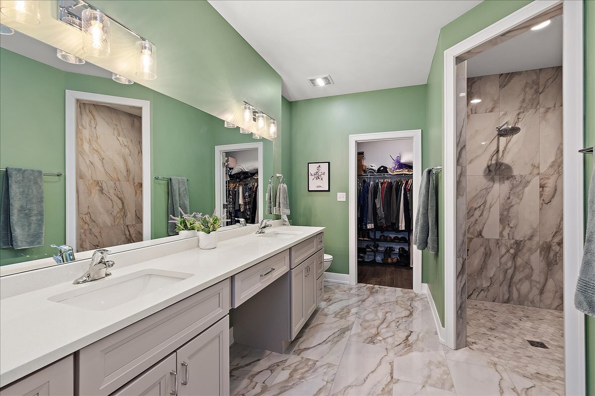 1330 Lacoma Drive Lockport, IL 60441 - Photo 16 of 36 a bathroom with a sink and a mirror