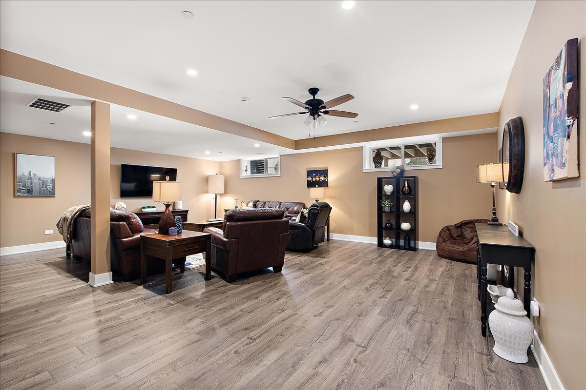 1330 Lacoma Drive Lockport, IL 60441 - Photo 23 of 36 a living room with furniture and a flat screen tv
