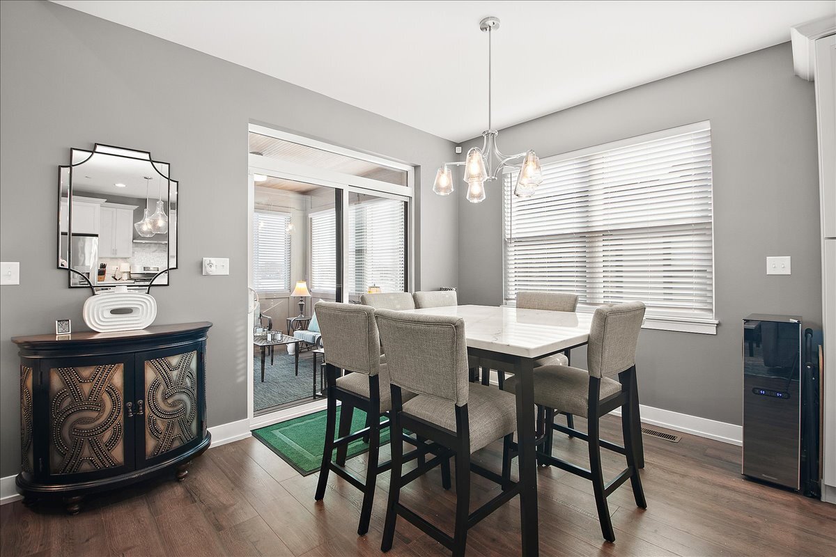 1330 Lacoma Drive Lockport, IL 60441 - Photo 10 of 36 a view of a dining room with furniture window and wooden floor