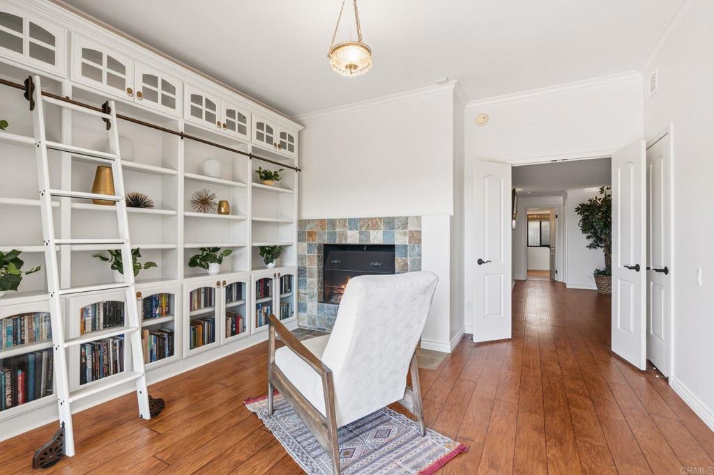 13319 Pacer Lane Poway, CA 92064 - Photo 35 of 75 a view of a livingroom with furniture and a book shelf