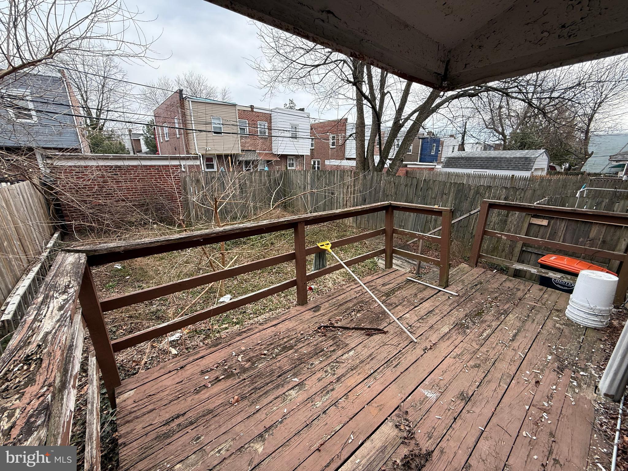23 East Mowry Street Chester, PA 19013 - Photo 17 of 18 a view of a roof deck with wooden floor and outdoor seating