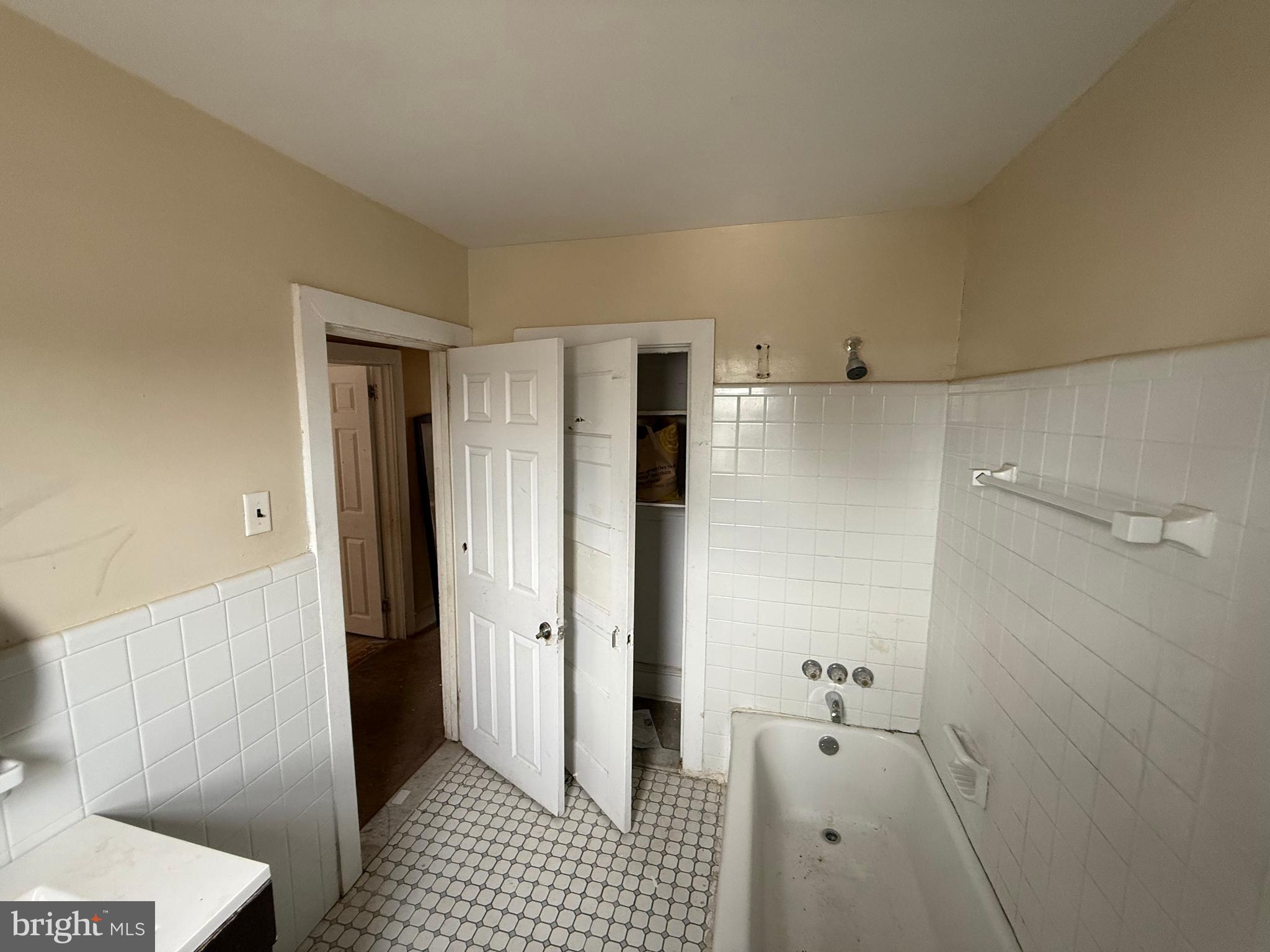 23 East Mowry Street Chester, PA 19013 - Photo 7 of 18 a bathroom with a shower and a toilet
