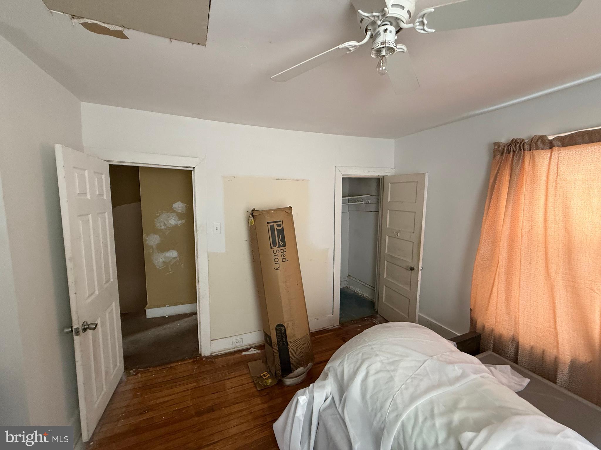 23 East Mowry Street Chester, PA 19013 - Photo 9 of 18 a bedroom with a bed and a large window