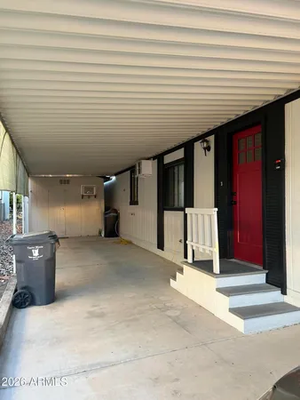 a view of a hall with wooden cabinets