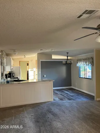 a view of a kitchen with a sink and cabinets