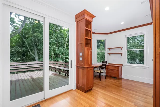 a view of workspace with furniture and window