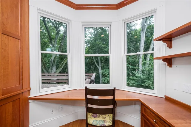 a view of a room with a window and a kitchen