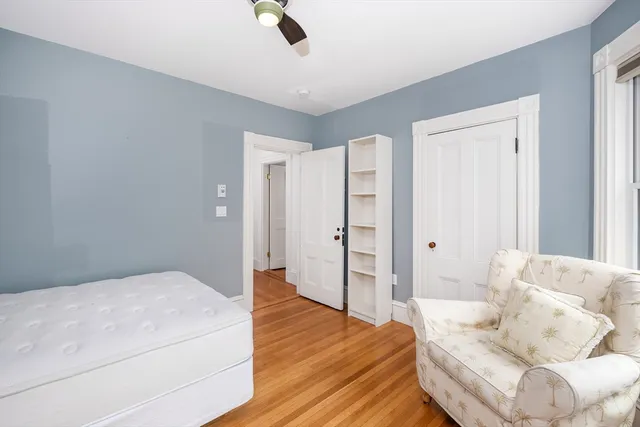 a spacious bedroom with a bed and couch