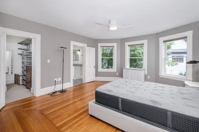 a bedroom with a large bed and a large window