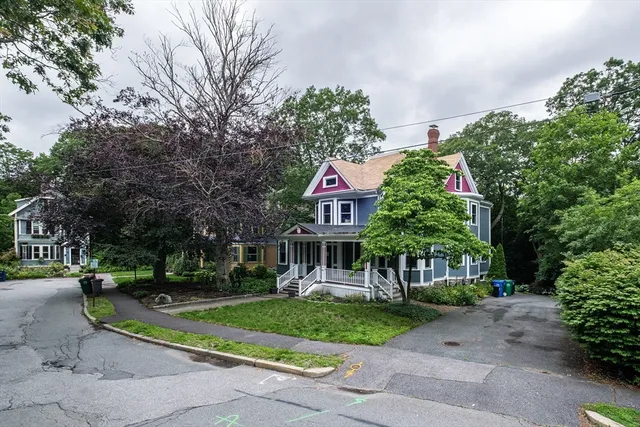 a view of a street with houses on both side