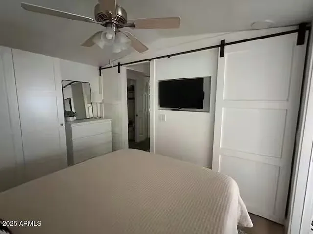 a large white bed in a white room