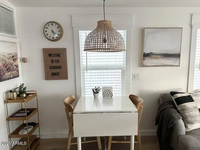 a view of a dining room with furniture and a table