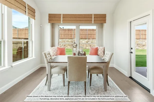 a dining room with furniture and wooden floor