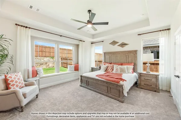 a bedroom with a bed window and couch