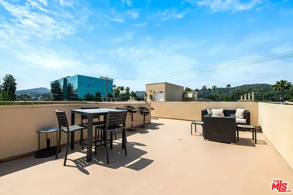 a view of a terrace with furniture
