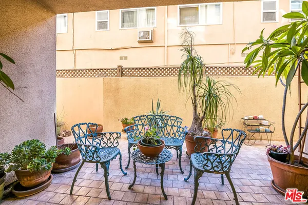 a view of a chairs and table on the terrace