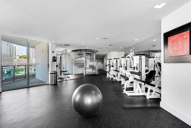 a bedroom with a bed and a view of bathroom