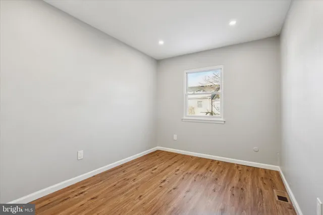 a kitchen with granite countertop a sink and cabinets