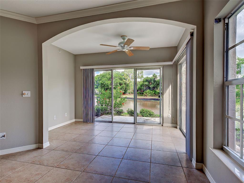 902 Addington Court, Unit 103 Venice, FL 34293 - Photo 13 of 48 a view of an empty room with a window