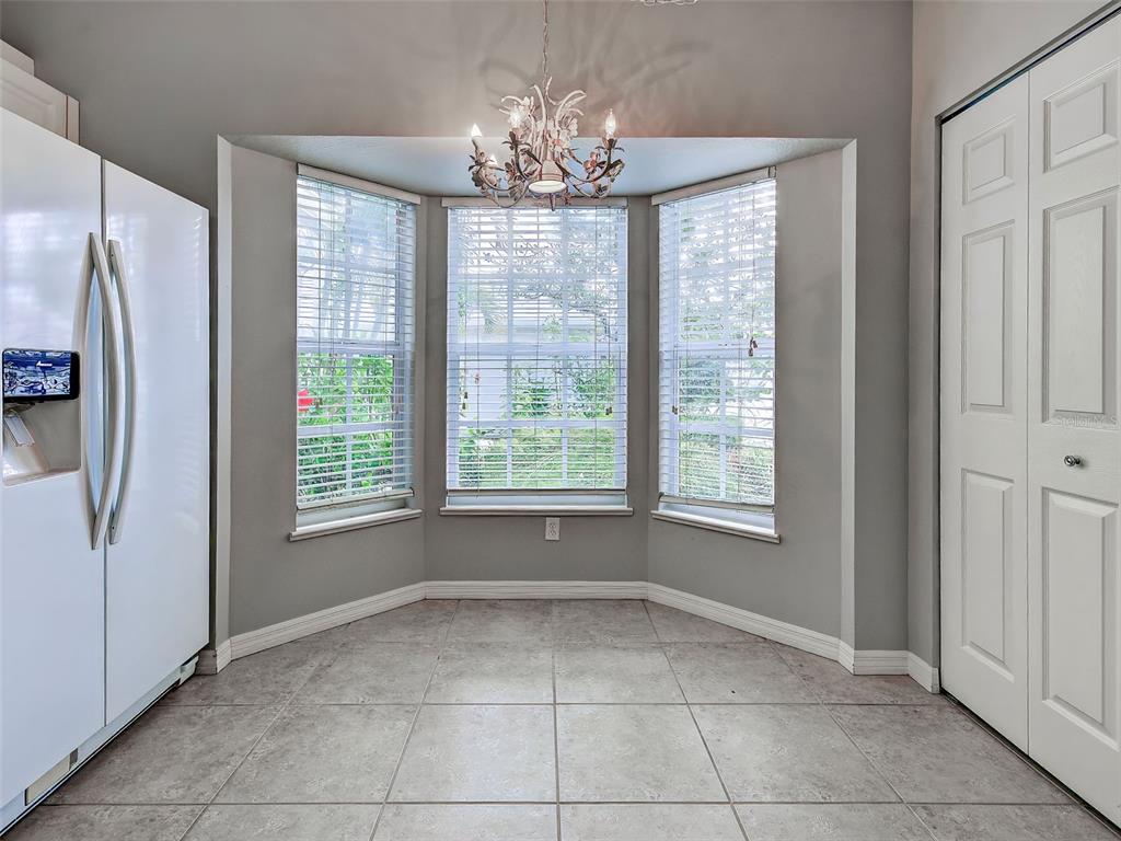 902 Addington Court, Unit 103 Venice, FL 34293 - Photo 17 of 48 a view of an empty room with a window