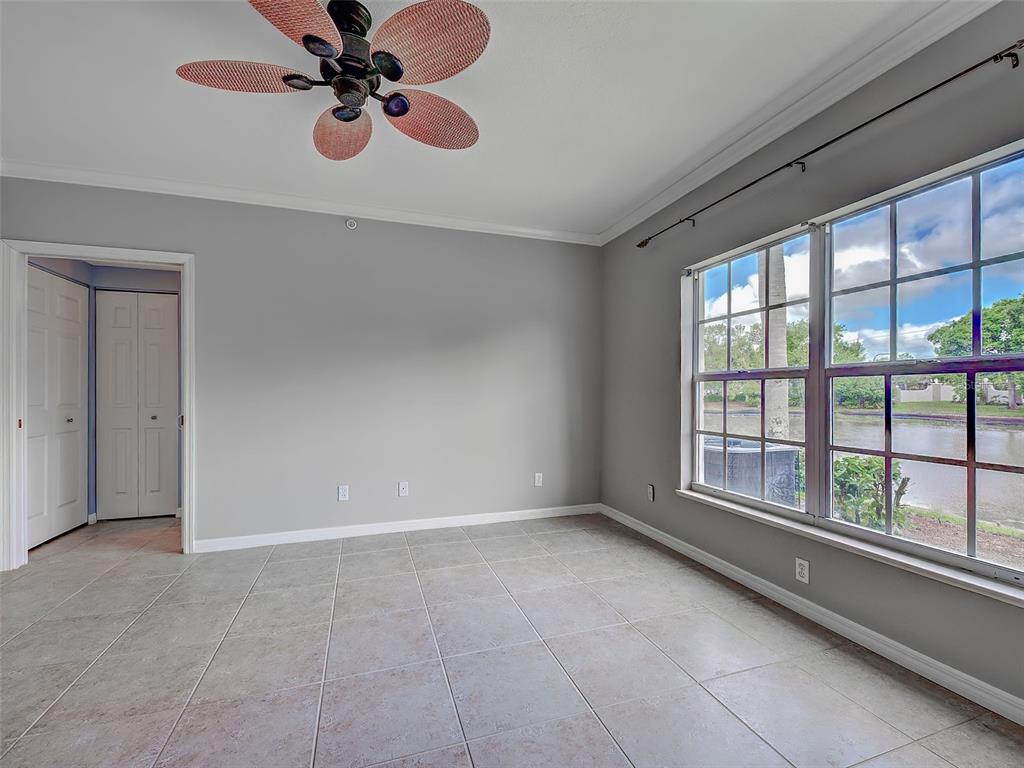 902 Addington Court, Unit 103 Venice, FL 34293 - Photo 20 of 48 a view of an empty room with a window