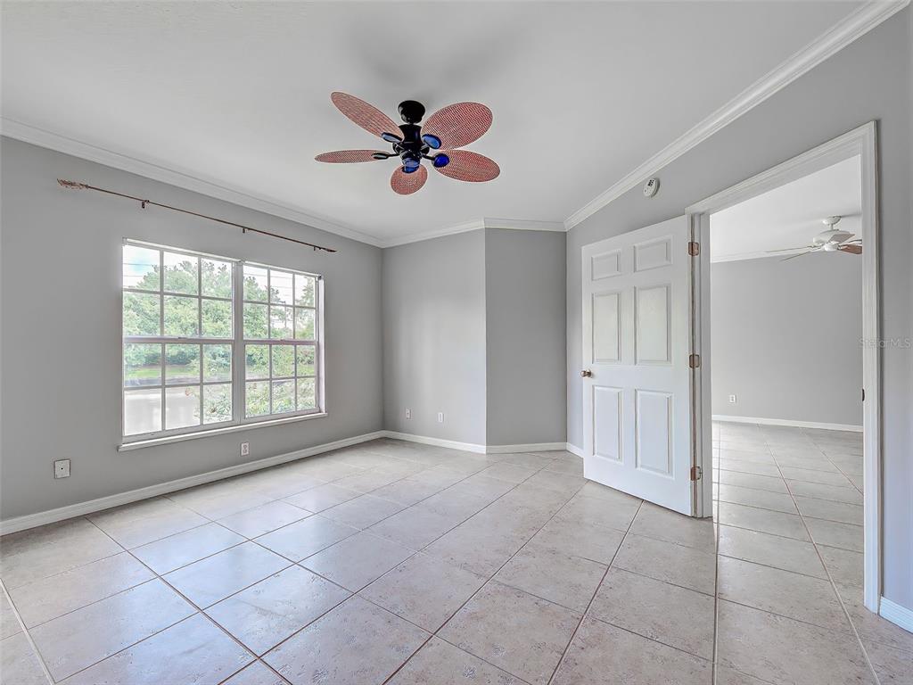 902 Addington Court, Unit 103 Venice, FL 34293 - Photo 21 of 48 a view of an empty room with a window