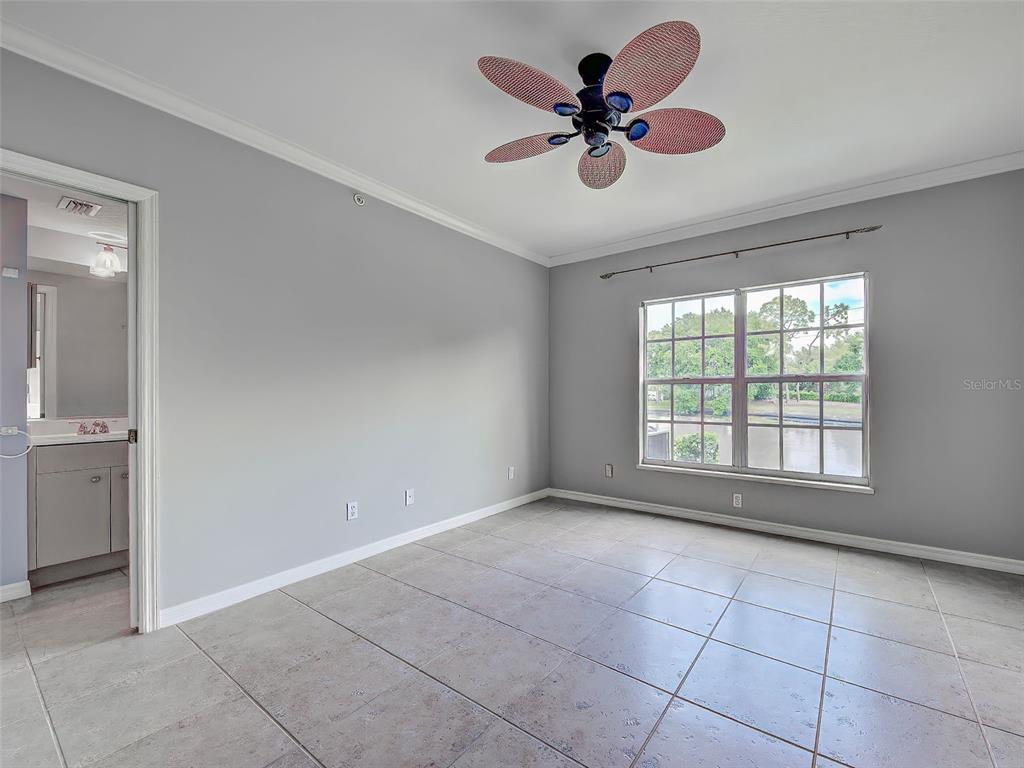902 Addington Court, Unit 103 Venice, FL 34293 - Photo 22 of 48 a view of an empty room with a window