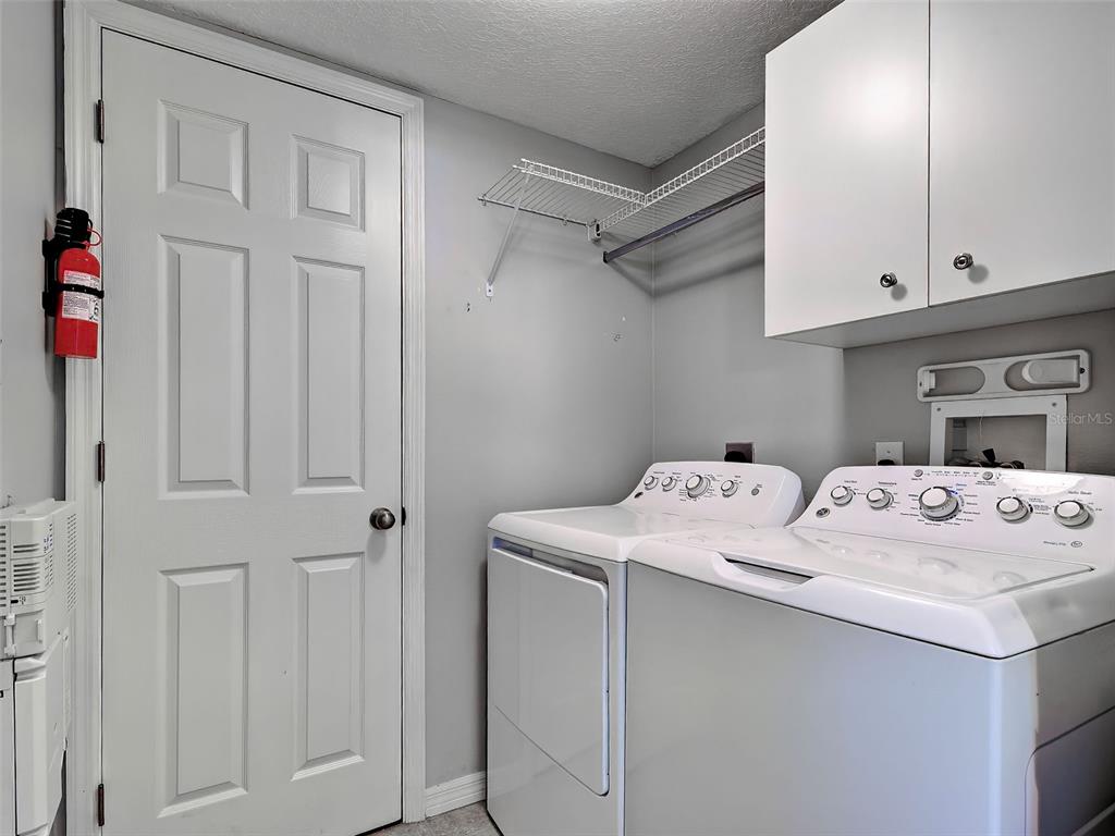 902 Addington Court, Unit 103 Venice, FL 34293 - Photo 30 of 48 a utility room with dryer and washer