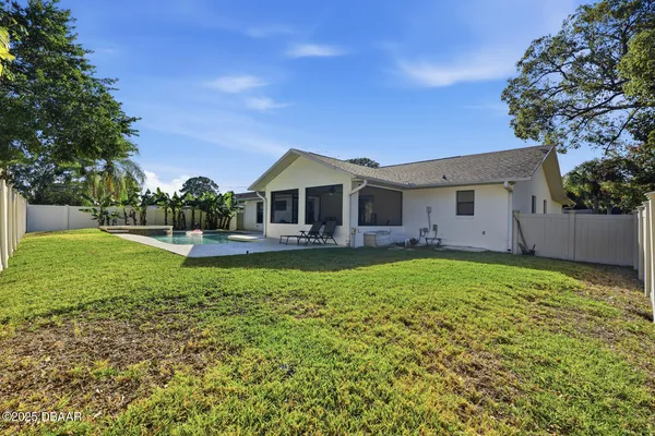 a view of backyard with green space