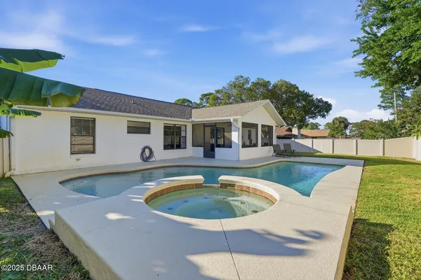 a view of a house with swimming pool
