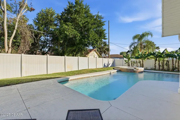 a view of house with a yard