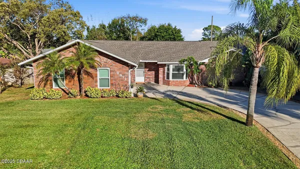 a view of house with back yard