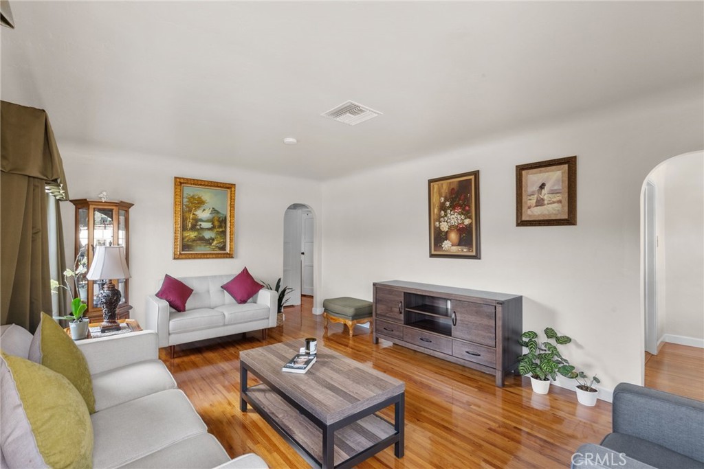 622 Griffith Street San Fernando, CA 91340 - Photo 11 of 35 a living room with furniture and wooden floor