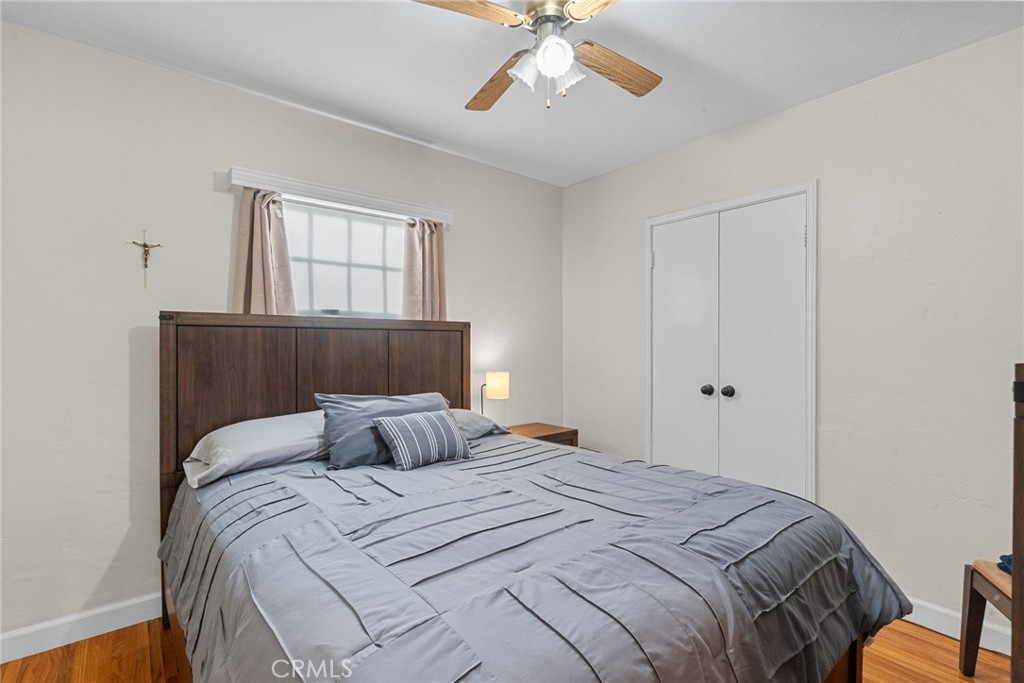 622 Griffith Street San Fernando, CA 91340 - Photo 14 of 35 a bedroom with a bed and window