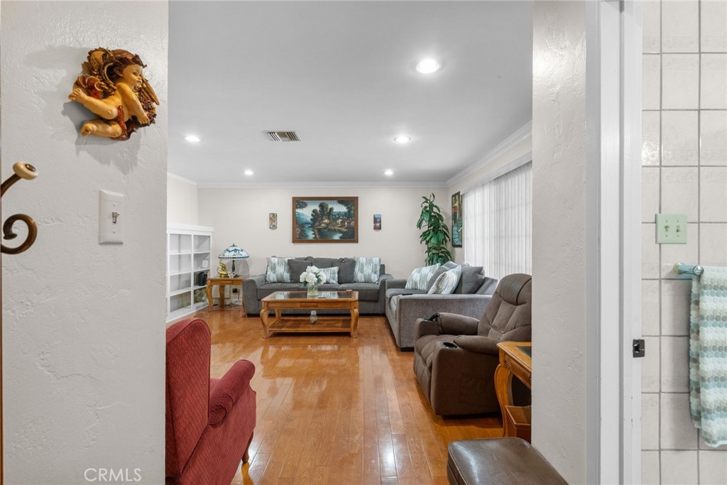 622 Griffith Street San Fernando, CA 91340 - Photo 17 of 35 a living room with furniture and wooden floor