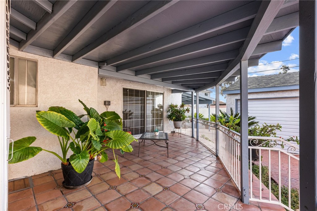 622 Griffith Street San Fernando, CA 91340 - Photo 29 of 35 a view of a porch with chairs and potted plants