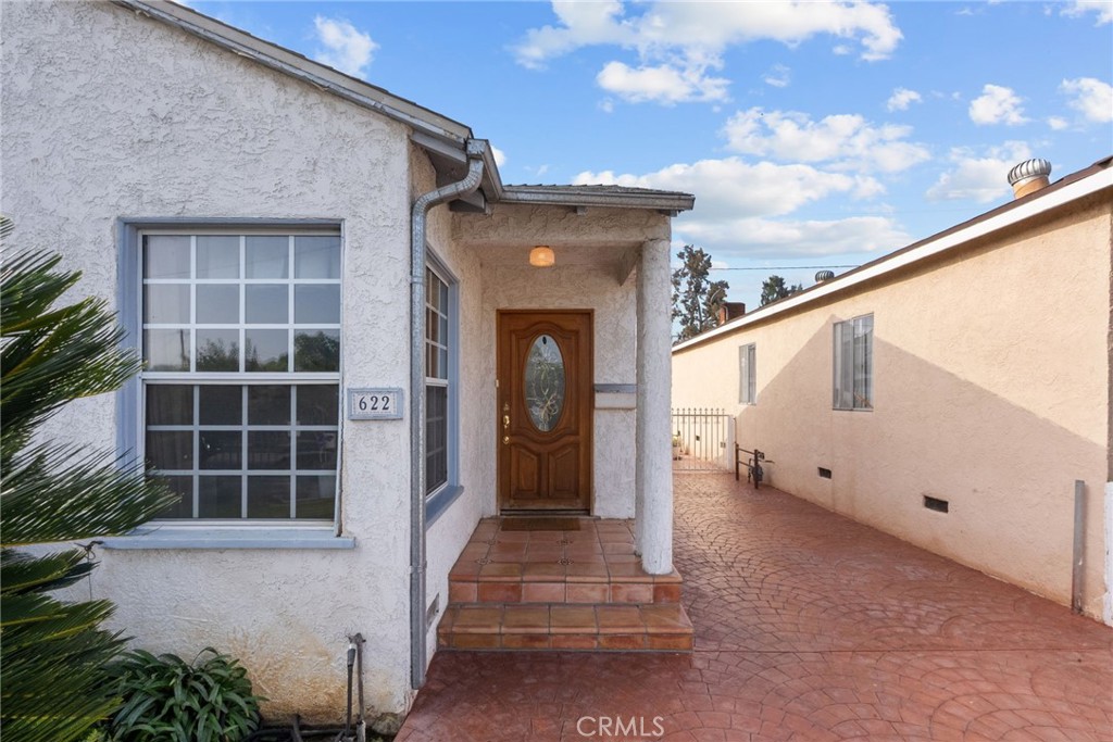 622 Griffith Street San Fernando, CA 91340 - Photo 4 of 35 a front view of a house with a entryway