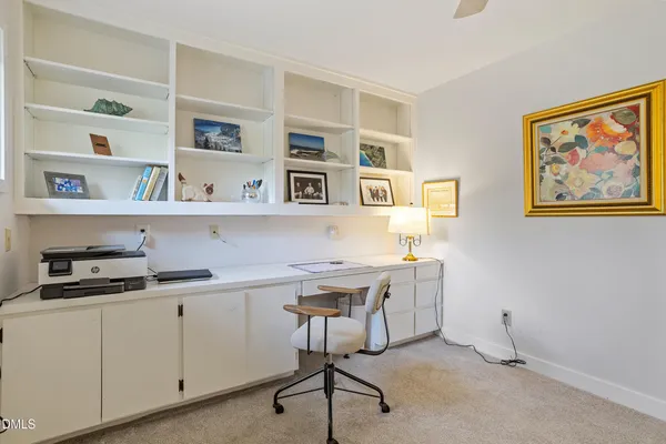 a view of workspace with cabinets