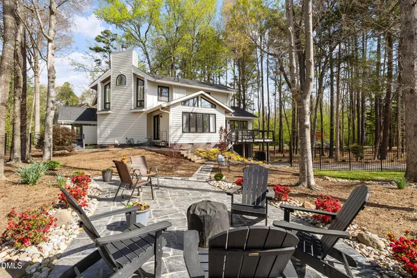 a view of a patio with couches chairs and a fire pit