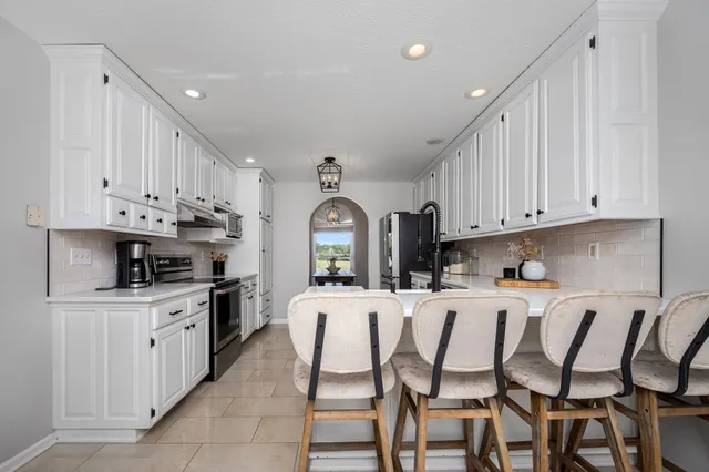 a living room with furniture fireplace and flat screen tv